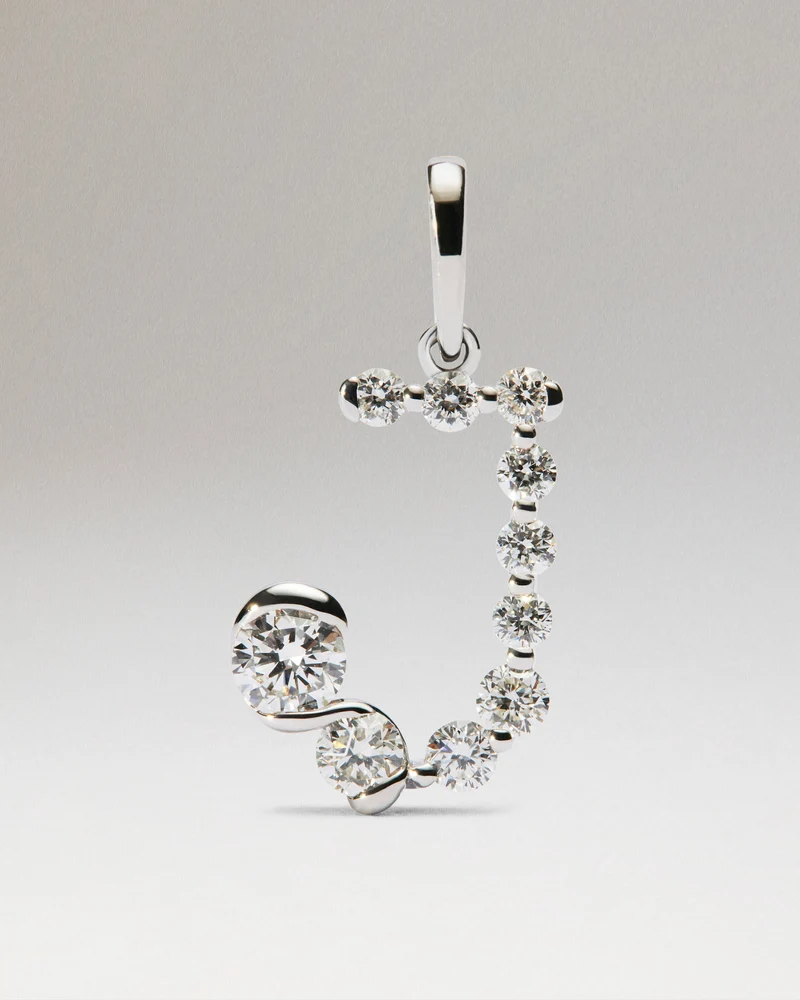 Diamonds and white gold J initial pendant