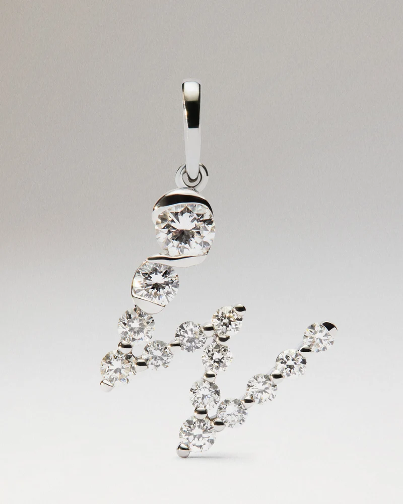 Diamonds and white gold W initial pendant