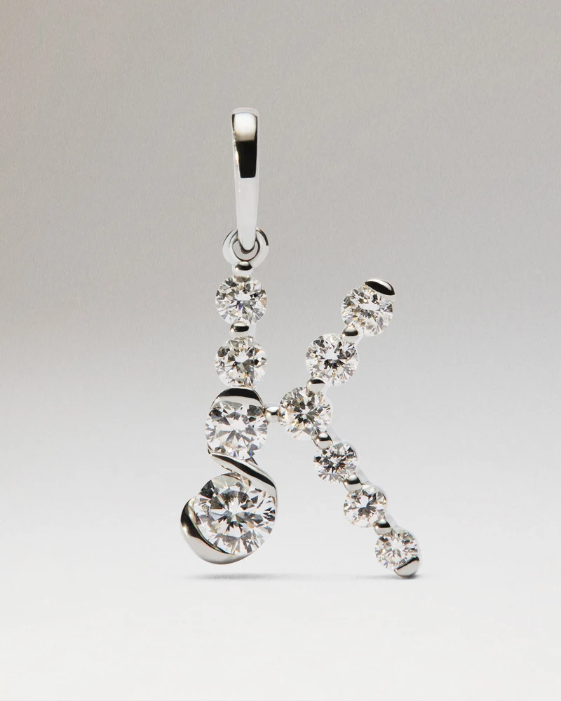 Diamonds and white gold K initial pendant
