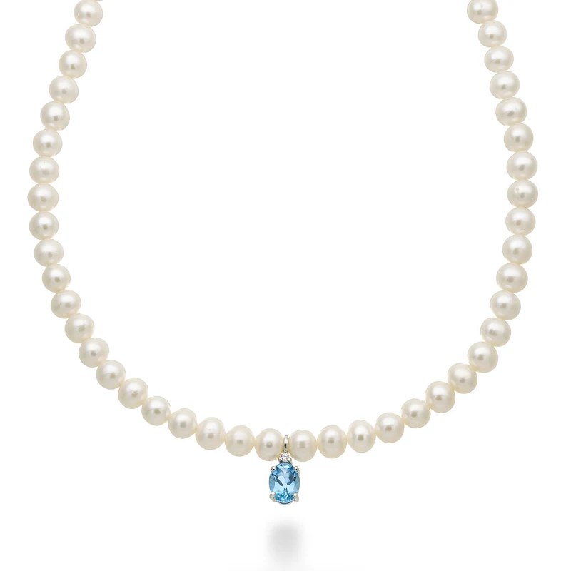 Nihama cl 18k fw 5,5/6 topazio swiss azzurro ovale 6x8 ct.1,50 diam. ct.0,02 anellino a molla NC1576O4TPSW55