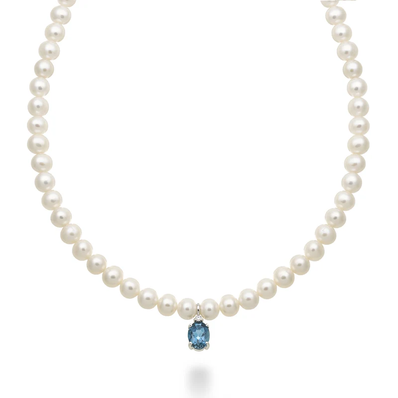 Nihama cl 18k fw 5,5/6 topazio blu london ovale 6x8 ct.1,40 diam. ct.0,02 anellino a molla NC1576O4TPBL55