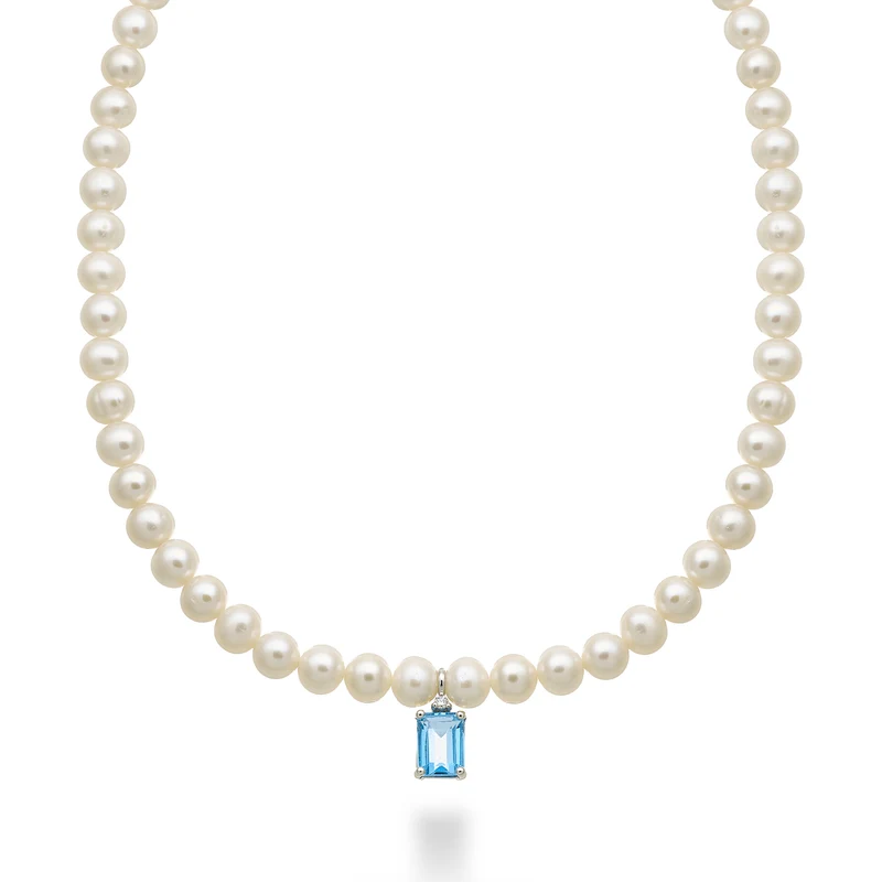 Nihama cl 18k fw 5,5/6 topazio swiss azzurro ott. 6x8 ct.2,10 diam. ct.0,02 anellino a molla NC1575O4TPSW55